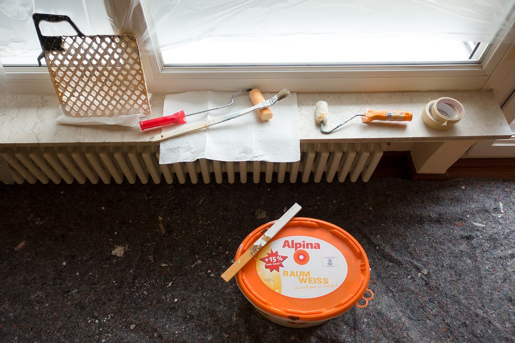 Home improvement workspace with tools and planning materials